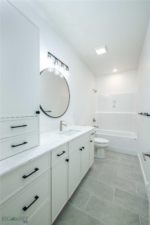 full bathroom with tile floors, shower / washtub combination, toilet, and vanity