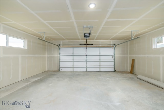 garage featuring a garage door opener