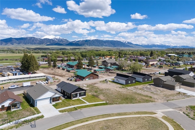 birds eye view of property with a mountain view