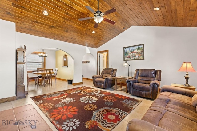 820 Miller Canyon Rd, Three Forks, MT 59752 - tiled living area with arched walkways, lofted ceiling, ceiling fan, baseboards, and wooden ceiling