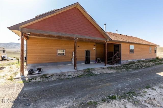 820 Miller Canyon Rd, Three Forks, MT 59752 - rear view of property featuring a mountain view and a patio