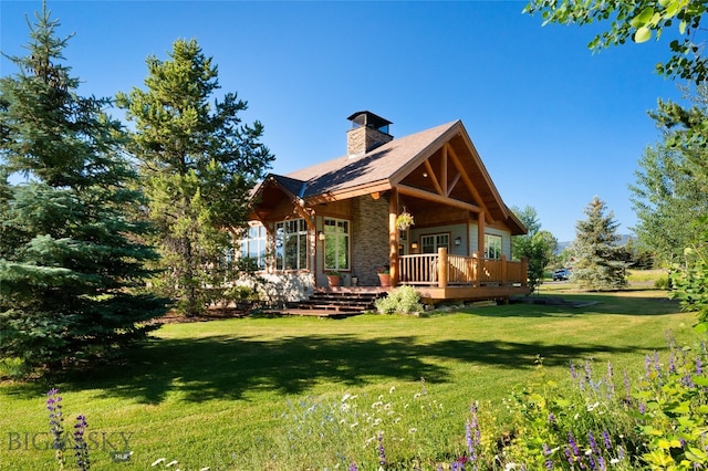 back of house featuring a lawn