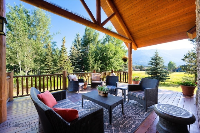 wooden deck featuring an outdoor hangout area