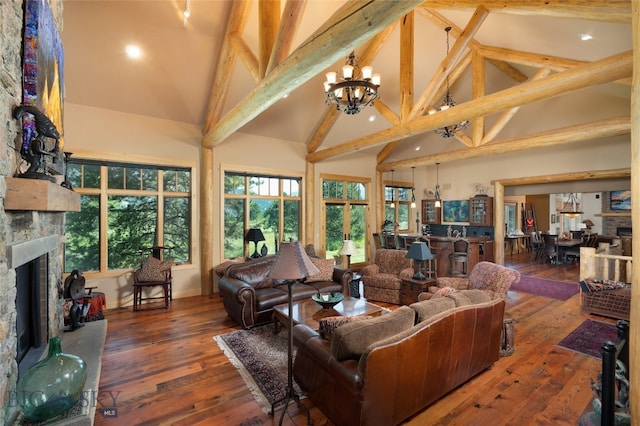 living room with beamed ceiling, a stone fireplace, high vaulted ceiling, wood-type flooring, and a notable chandelier