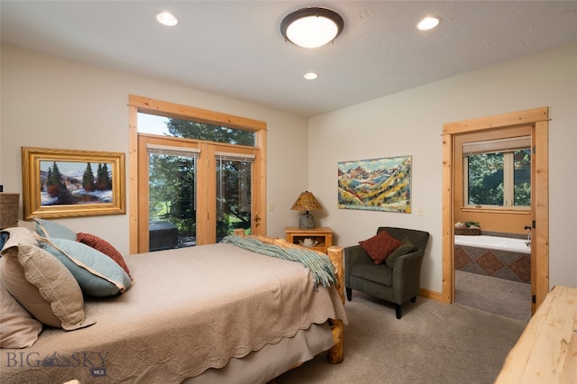 bedroom featuring access to exterior, carpet, and ensuite bath