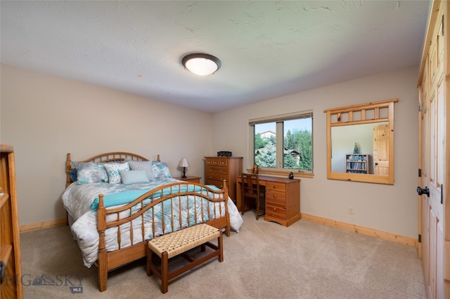 bedroom with light carpet