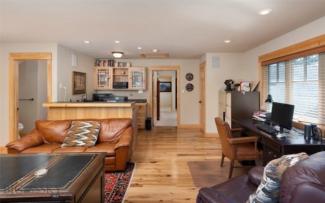 living room with light hardwood / wood-style flooring