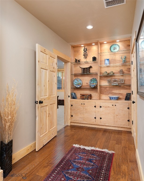 home office with hardwood / wood-style floors