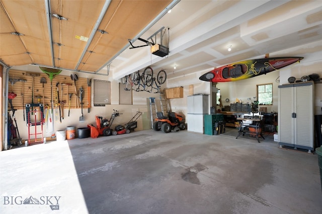 garage featuring a workshop area and a garage door opener