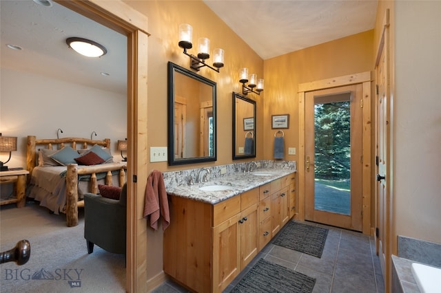 bathroom with tile patterned flooring and dual bowl vanity