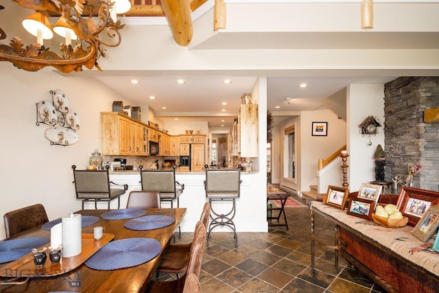 dining space with a chandelier