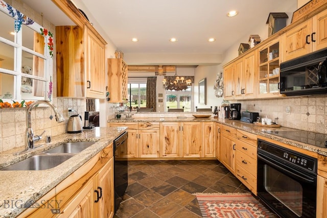 kitchen featuring black appliances, decorative backsplash, light stone countertops, and sink