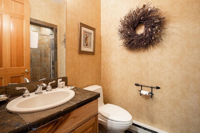 bathroom with vanity, toilet, and a baseboard radiator