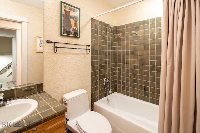 full bathroom with shower / bath combo with shower curtain, vanity, and toilet