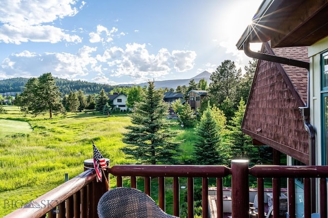 exterior space with a mountain view and a balcony