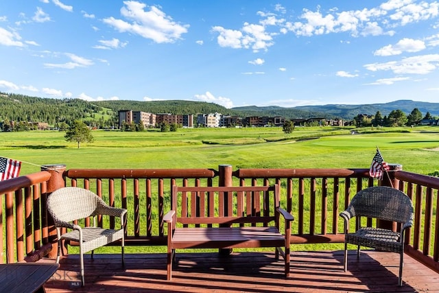 wooden deck with a mountain view