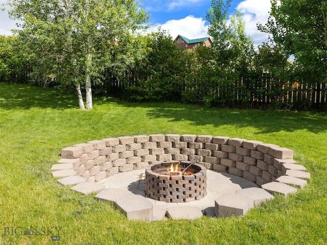 view of yard with a fire pit