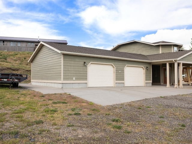 view of property exterior with a garage