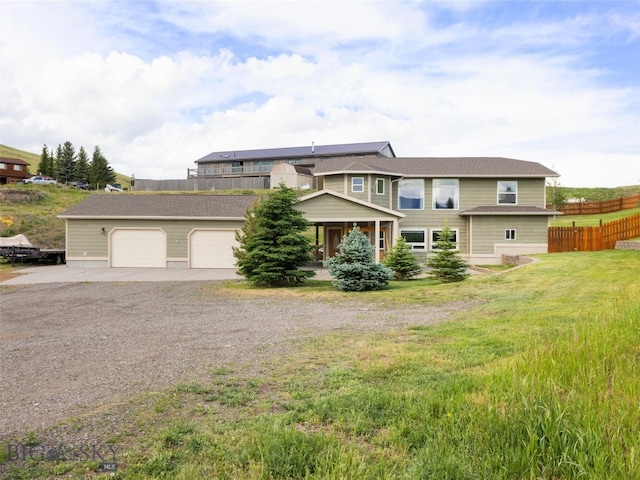 view of front facade with a garage and a front lawn