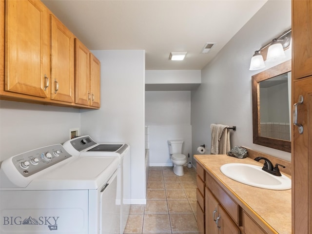 laundry area featuring hookup for a washing machine, sink, washer and dryer, and light tile floors