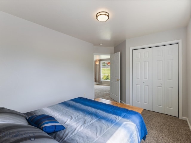 carpeted bedroom with a closet