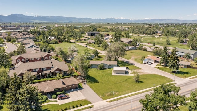 birds eye view of property featuring a mountain view