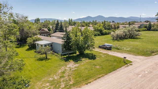 birds eye view of property featuring a mountain view