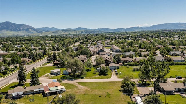 birds eye view of property with a mountain view