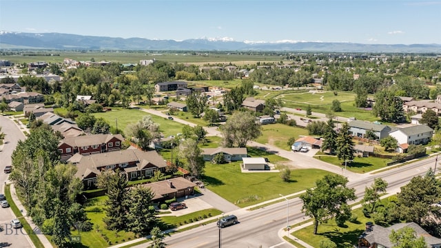 birds eye view of property with a mountain view