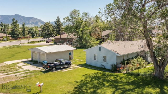 birds eye view of property with a mountain view