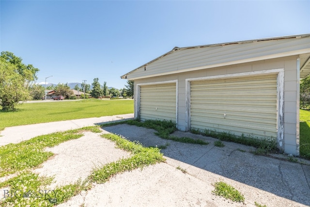 garage with a lawn