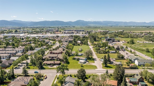 birds eye view of property with a mountain view