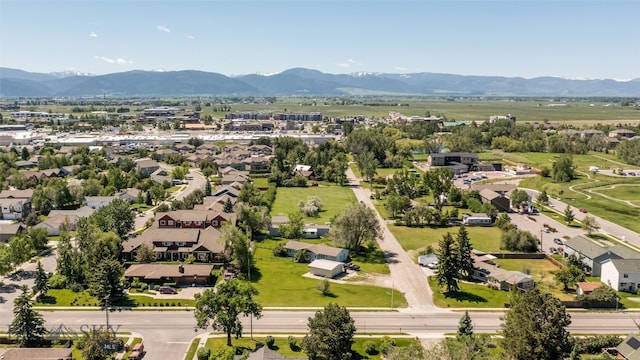 birds eye view of property with a mountain view