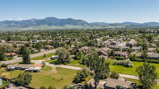 birds eye view of property with a mountain view