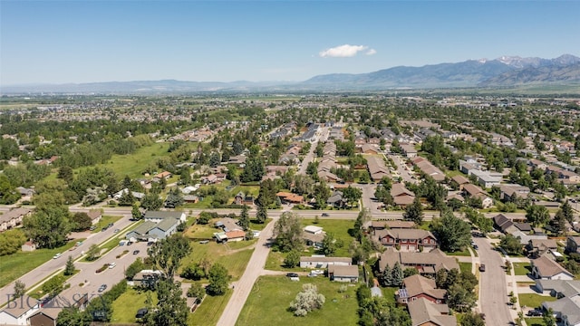 birds eye view of property with a mountain view