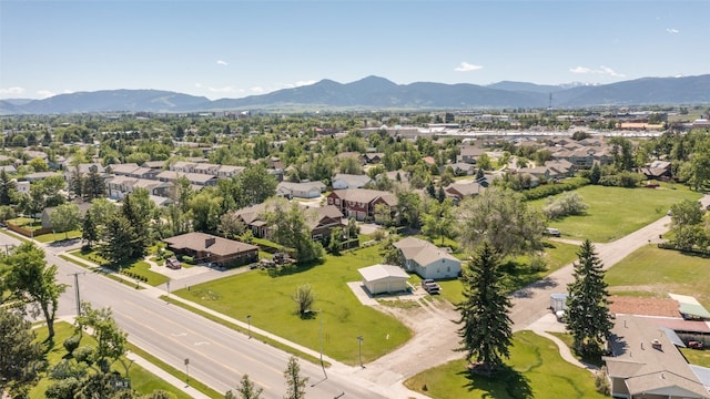 birds eye view of property with a mountain view