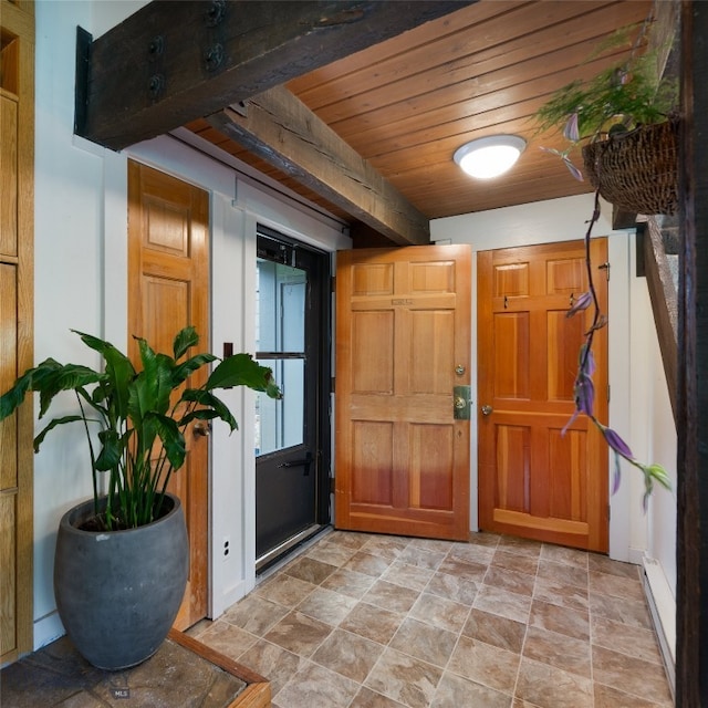 tiled entryway with wooden ceiling