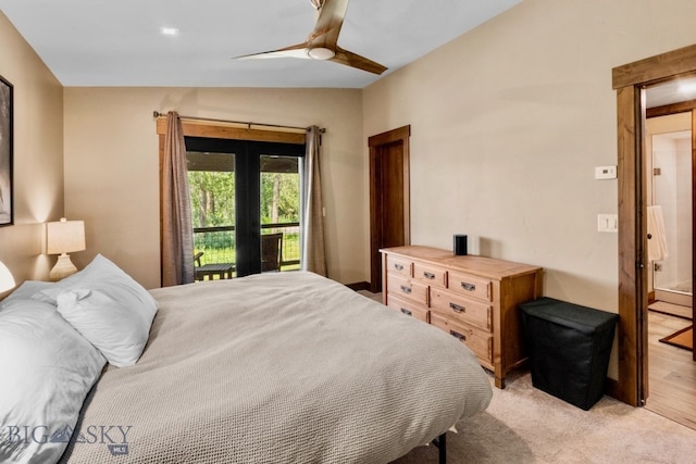 carpeted bedroom featuring ceiling fan, connected bathroom, and lofted ceiling