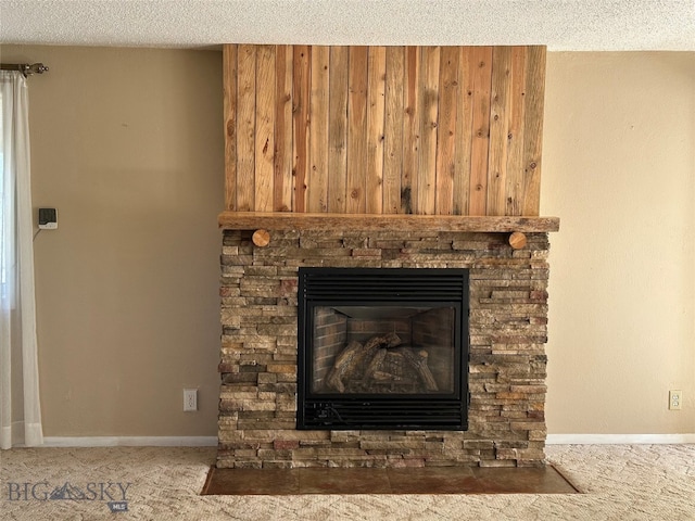 details with a fireplace, carpet, and a textured ceiling