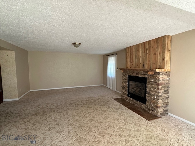 unfurnished living room featuring a textured ceiling, a fireplace, and wooden walls