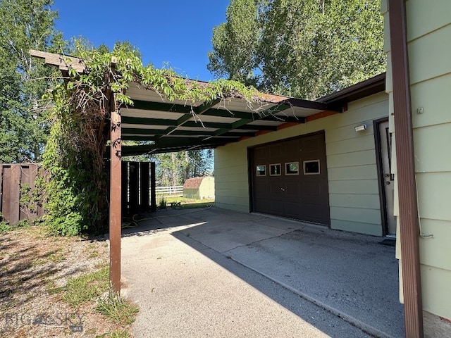 view of vehicle parking featuring a garage and a carport