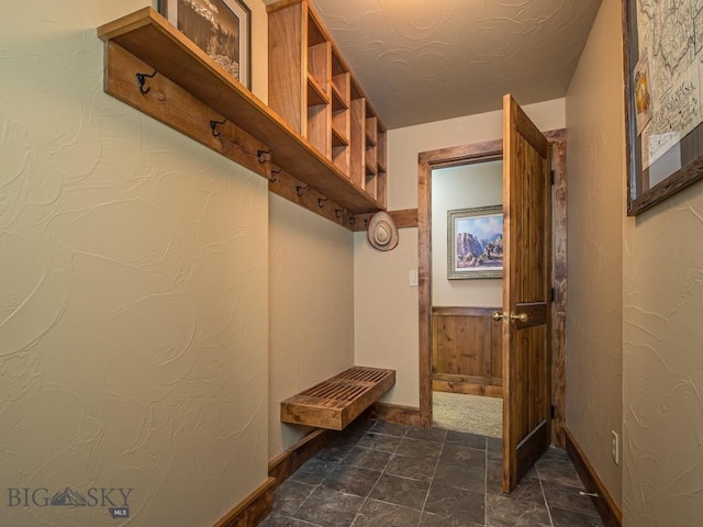 mudroom with a textured ceiling