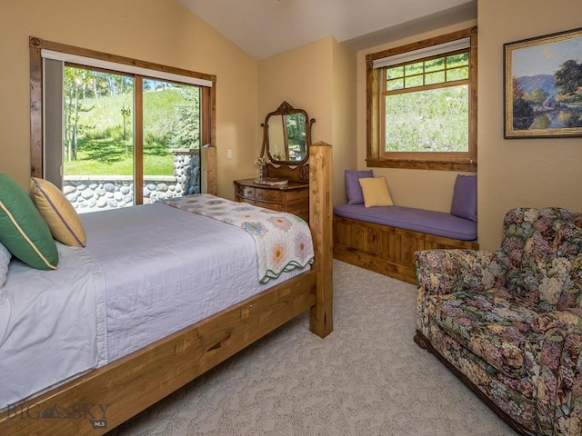 bedroom featuring vaulted ceiling, light carpet, and access to outside