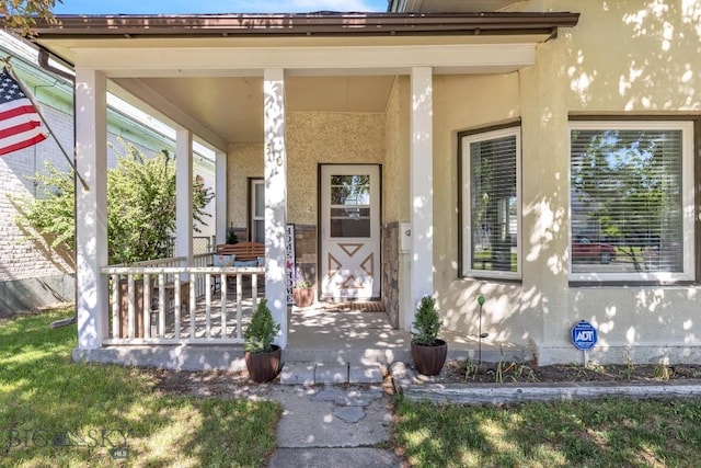 property entrance featuring a porch