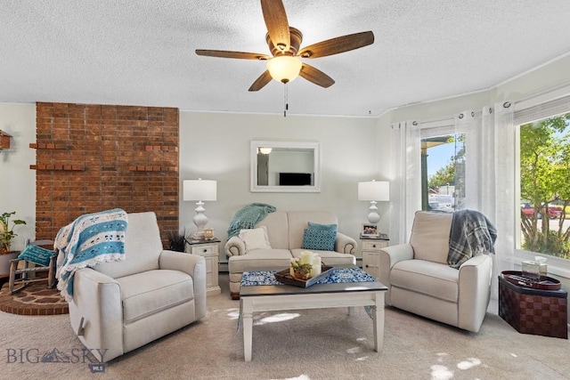 carpeted living room featuring a textured ceiling and ceiling fan