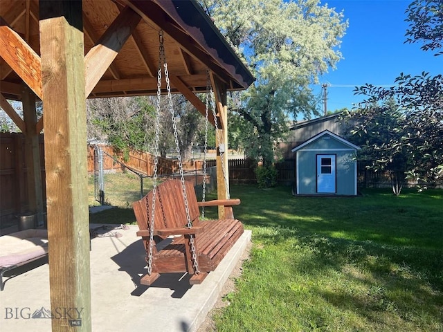 view of yard featuring a patio and a storage unit