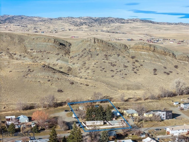 bird's eye view with a mountain view and view of desert