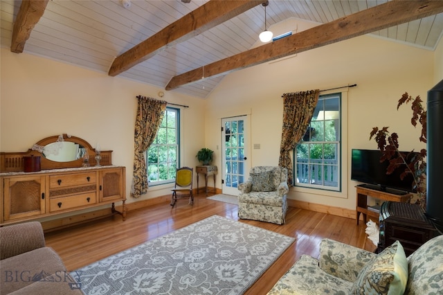 living room with wood ceiling, lofted ceiling with beams, and light hardwood / wood-style floors