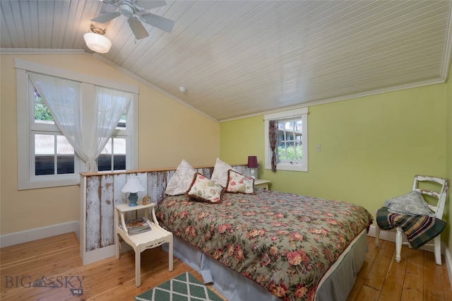 bedroom featuring ornamental molding, ceiling fan, and light hardwood / wood-style floors