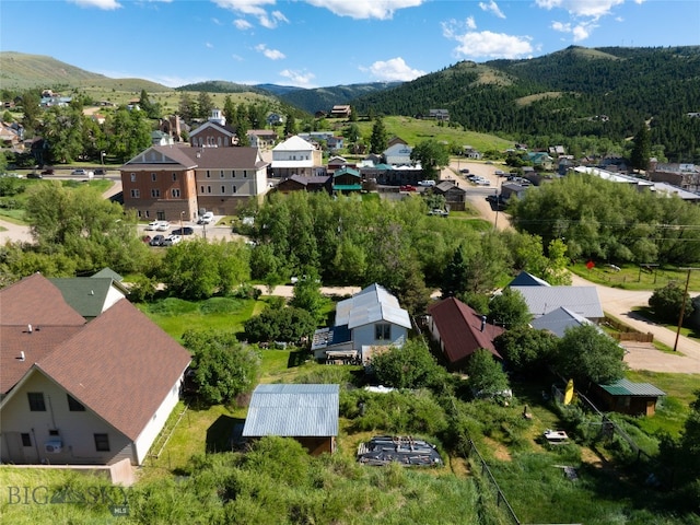 birds eye view of property with a mountain view